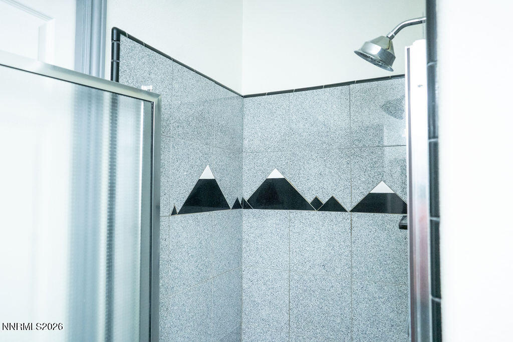 2931 Airport Road Carson City, NV 89706 - Photo 8 of 35 a bathroom with a shower and a walk in closet