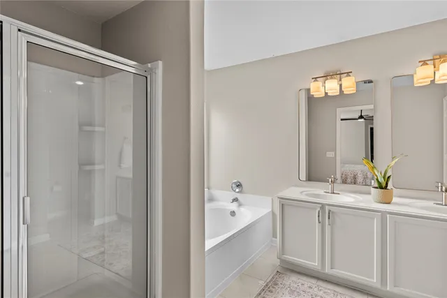 a bathroom with a double vanity sink and a mirror
