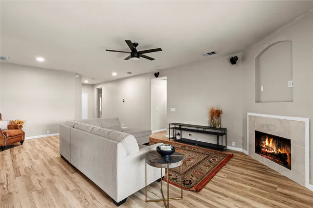 a living room with furniture and a fireplace