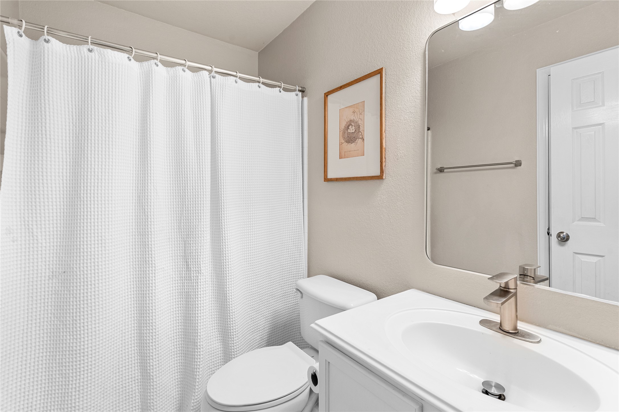 292 Spruce Drive Kyle, TX 78640 - Photo 10 of 25 a bathroom with a sink and toilet