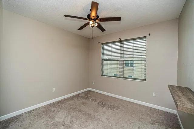 a bathroom with a sink shower and a mirror