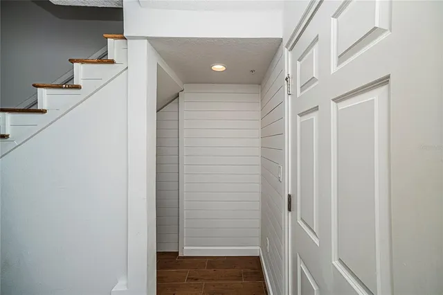 a view of a livingroom with a ceiling fan and window