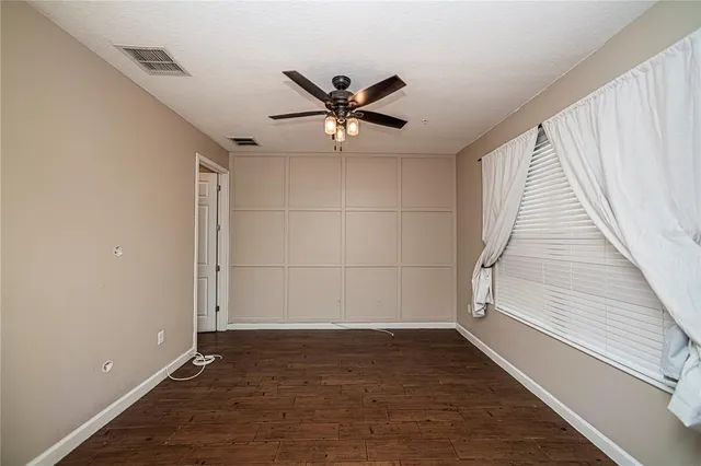 a bathroom with a double vanity sink toilet mirror and shower