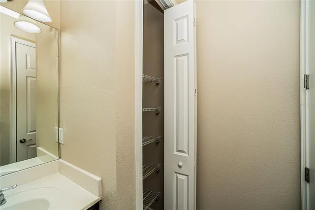 an empty room with wooden floor and closet