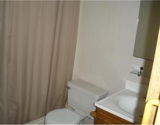 3938 Surfside, Unit 2117 Corpus Christi, TX 78402 - Photo 5 of 10 a white toilet sitting next to a sink