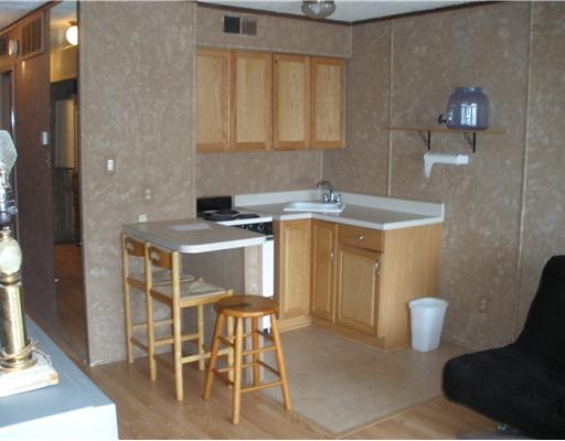 3938 Surfside, Unit 2117 Corpus Christi, TX 78402 - Photo 7 of 10 a kitchen with a sink cabinets and window