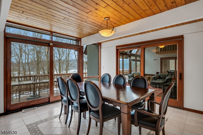 39 Woodland Road Morristown, NJ 07960 - Photo 12 of 34 a dining room with furniture a chandelier and wooden floor