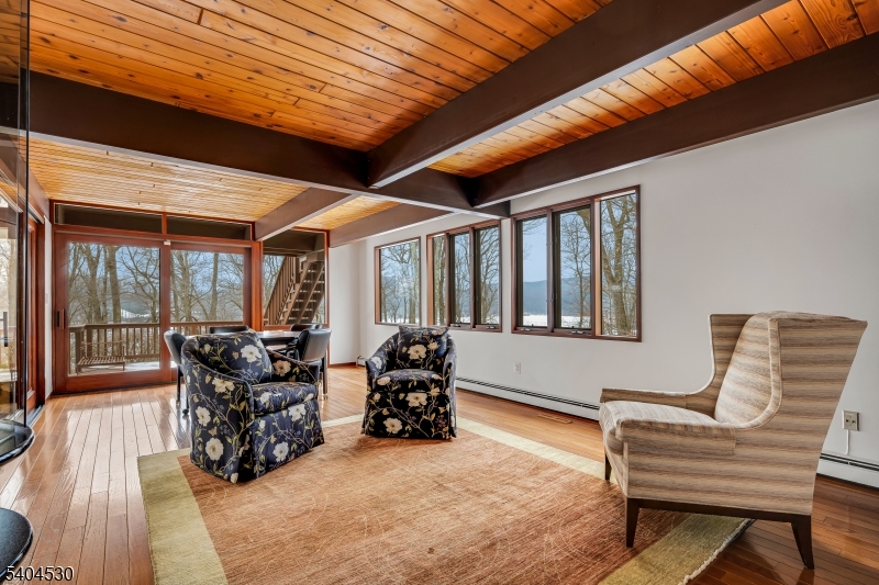 39 Woodland Road Morristown, NJ 07960 - Photo 14 of 34 a bedroom with furniture and large windows