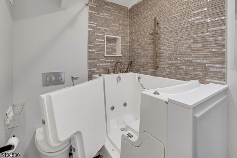 39 Woodland Road Morristown, NJ 07960 - Photo 26 of 34 a bathroom with a sink a toilet and shower