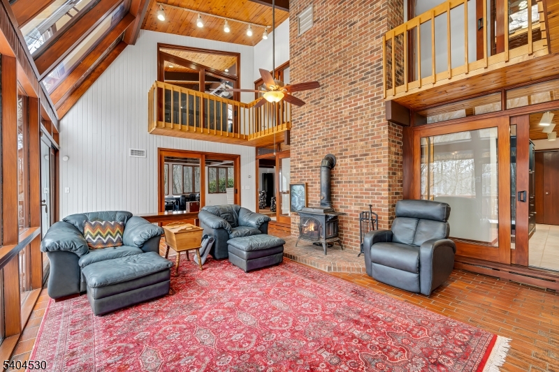 39 Woodland Road Morristown, NJ 07960 - Photo 6 of 34 a building outdoor space with patio couch and wooden floor