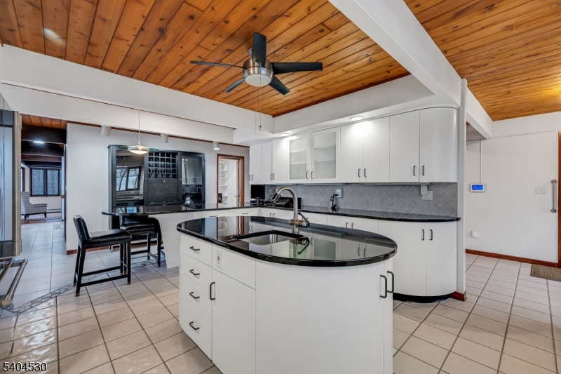 39 Woodland Road Morristown, NJ 07960 - Photo 9 of 34 a kitchen with stainless steel appliances granite countertop a sink and cabinets