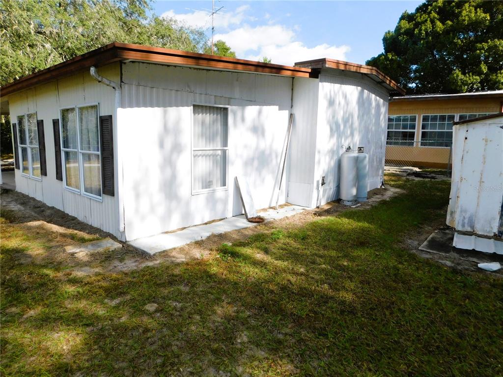 34912 Hawkiowa Road Dade City, FL 33523 - Photo 4 of 7 a backyard of a house with lots of green space