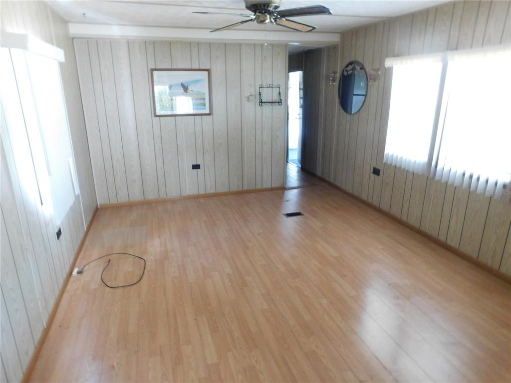 34912 Hawkiowa Road Dade City, FL 33523 - Photo 7 of 7 a view of a livingroom with wooden floor and window