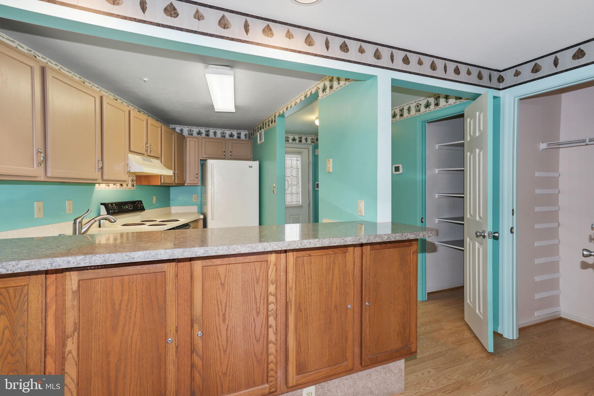 249 Sycamore Ridge Road Laurel, MD 20724 - Photo 14 of 31 Kitchen w/See-through Island to Living Room