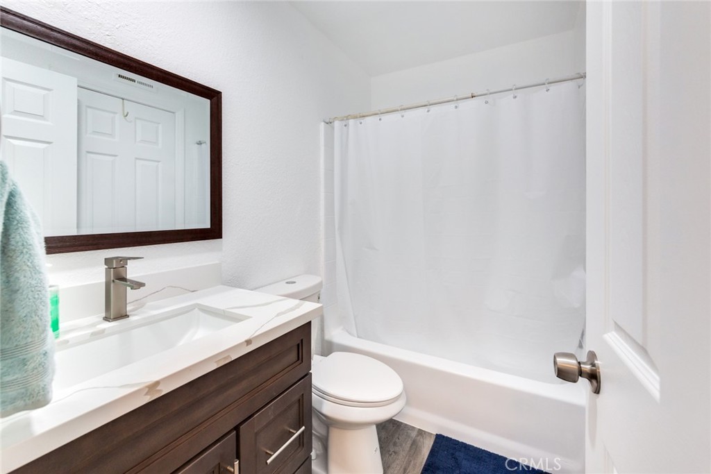 4179 Shellicia Circle Jurupa Valley, CA 92509 - Photo 17 of 25 a bathroom with a sink a toilet and shower