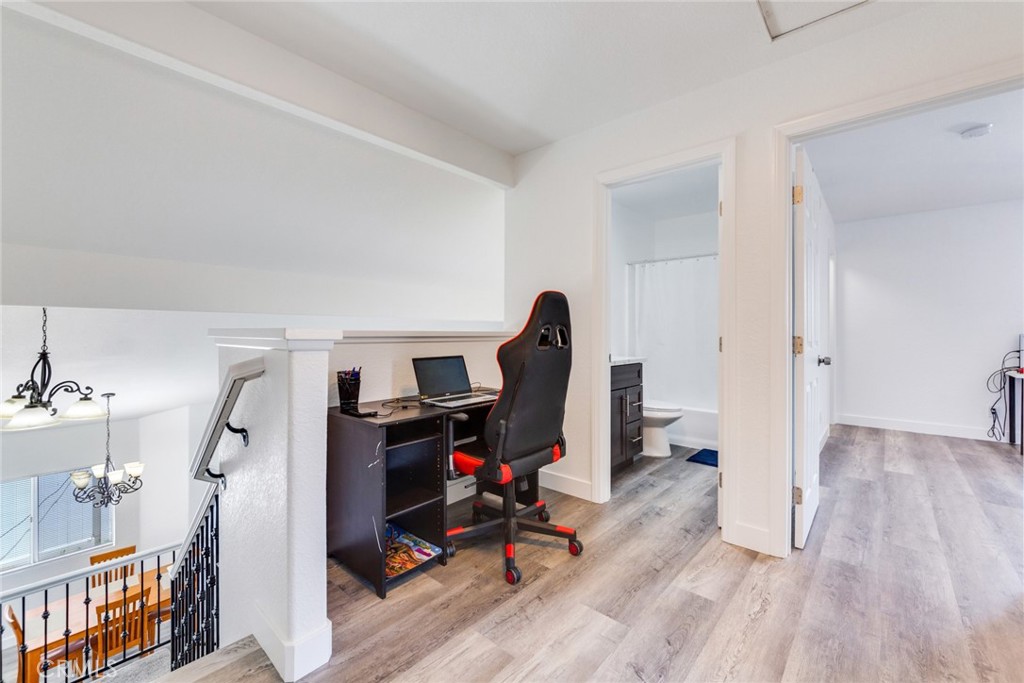 4179 Shellicia Circle Jurupa Valley, CA 92509 - Photo 18 of 25 a view of a workspace with furniture and wooden floor