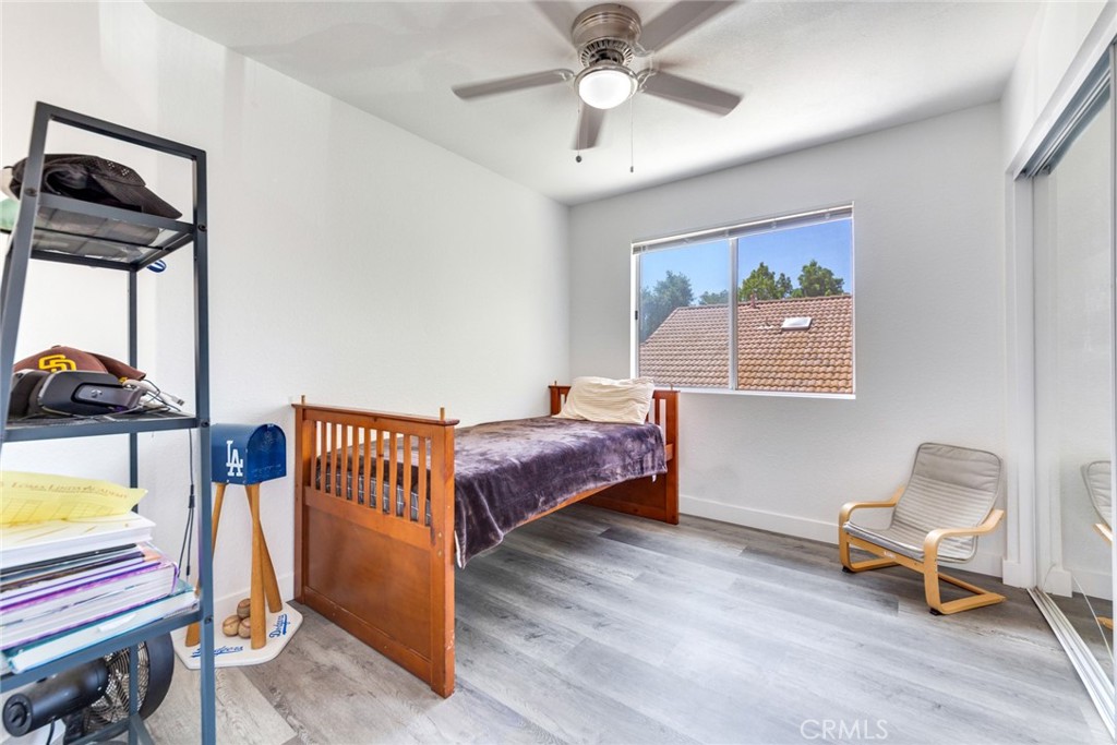 4179 Shellicia Circle Jurupa Valley, CA 92509 - Photo 19 of 25 a bedroom with a bed and a window