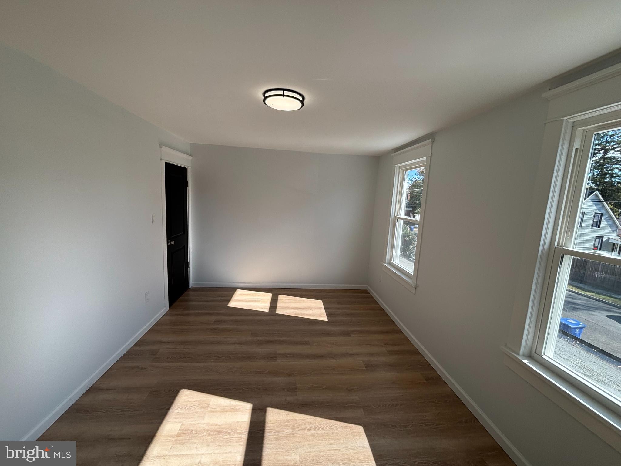 59 Pine Street Beverly, NJ 08010 - Photo 14 of 25 a view of an empty room and window