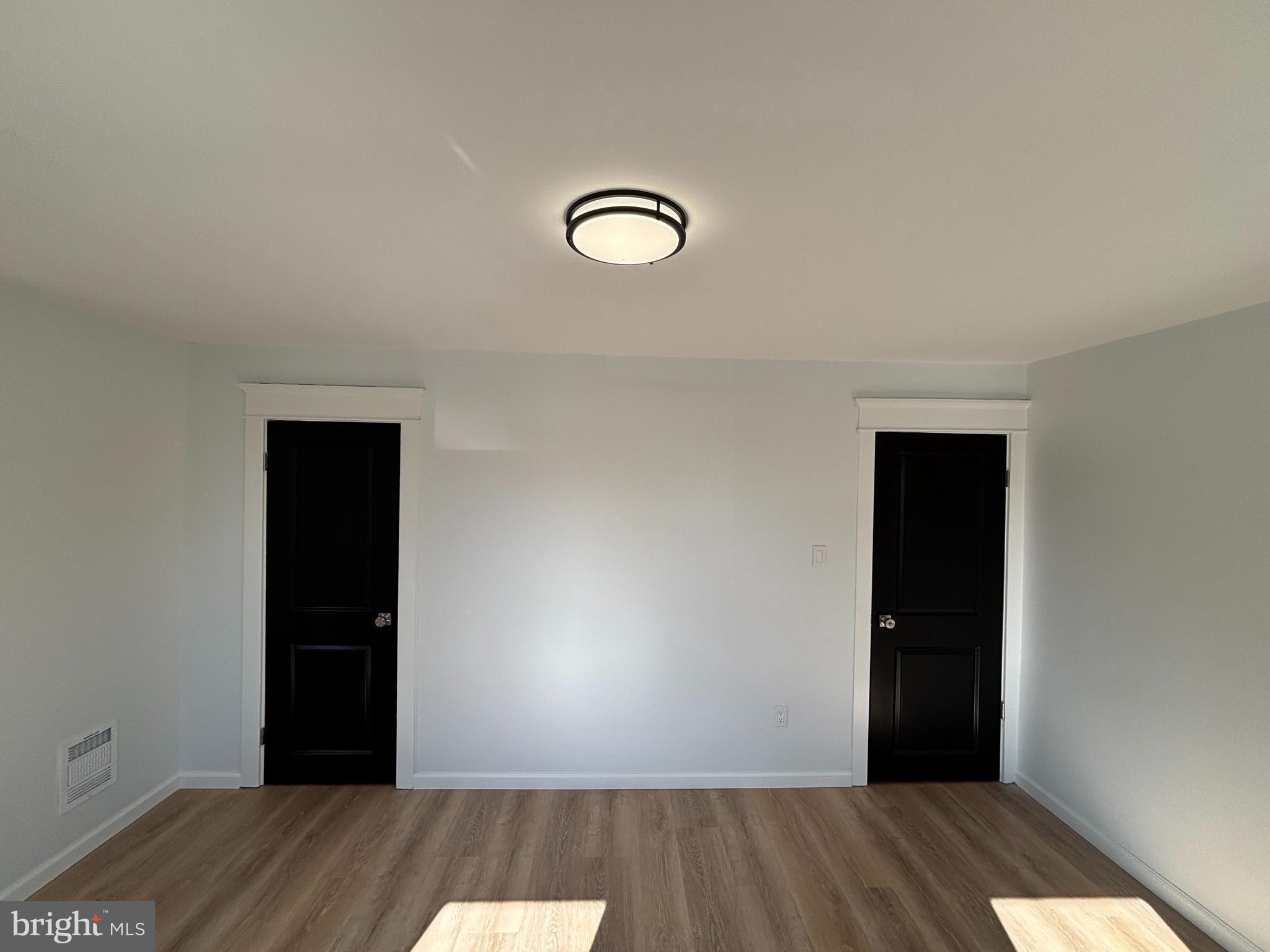 59 Pine Street Beverly, NJ 08010 - Photo 17 of 25 an empty room with wooden floor