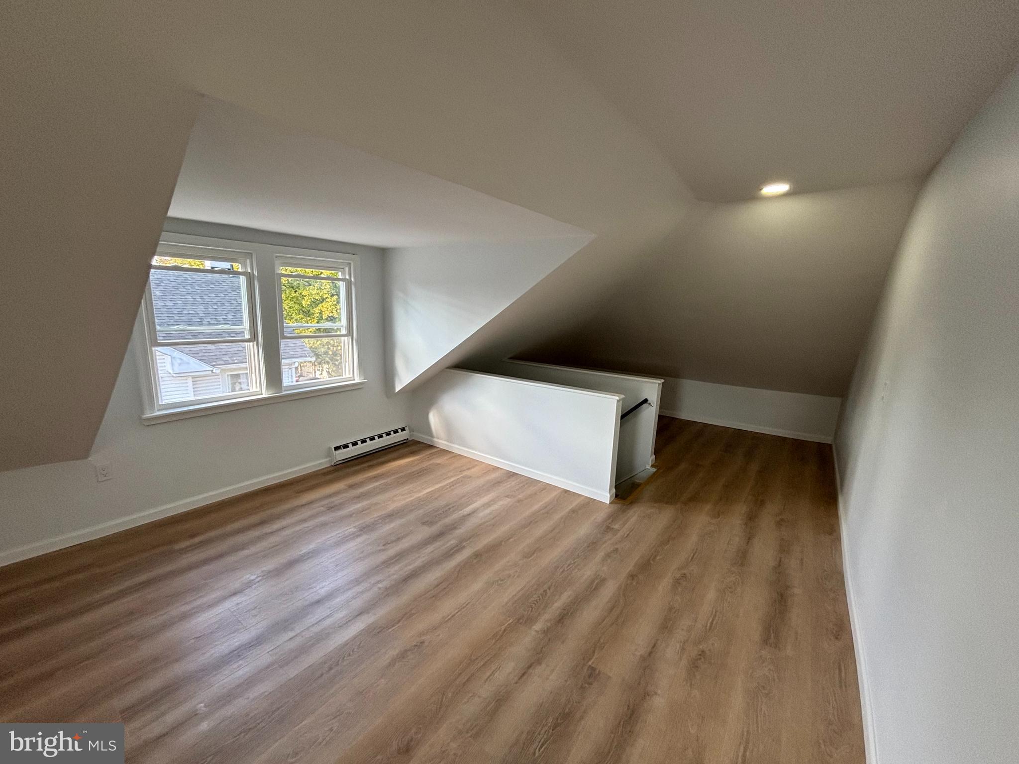 59 Pine Street Beverly, NJ 08010 - Photo 20 of 25 a view of an empty room with wooden floor and a window