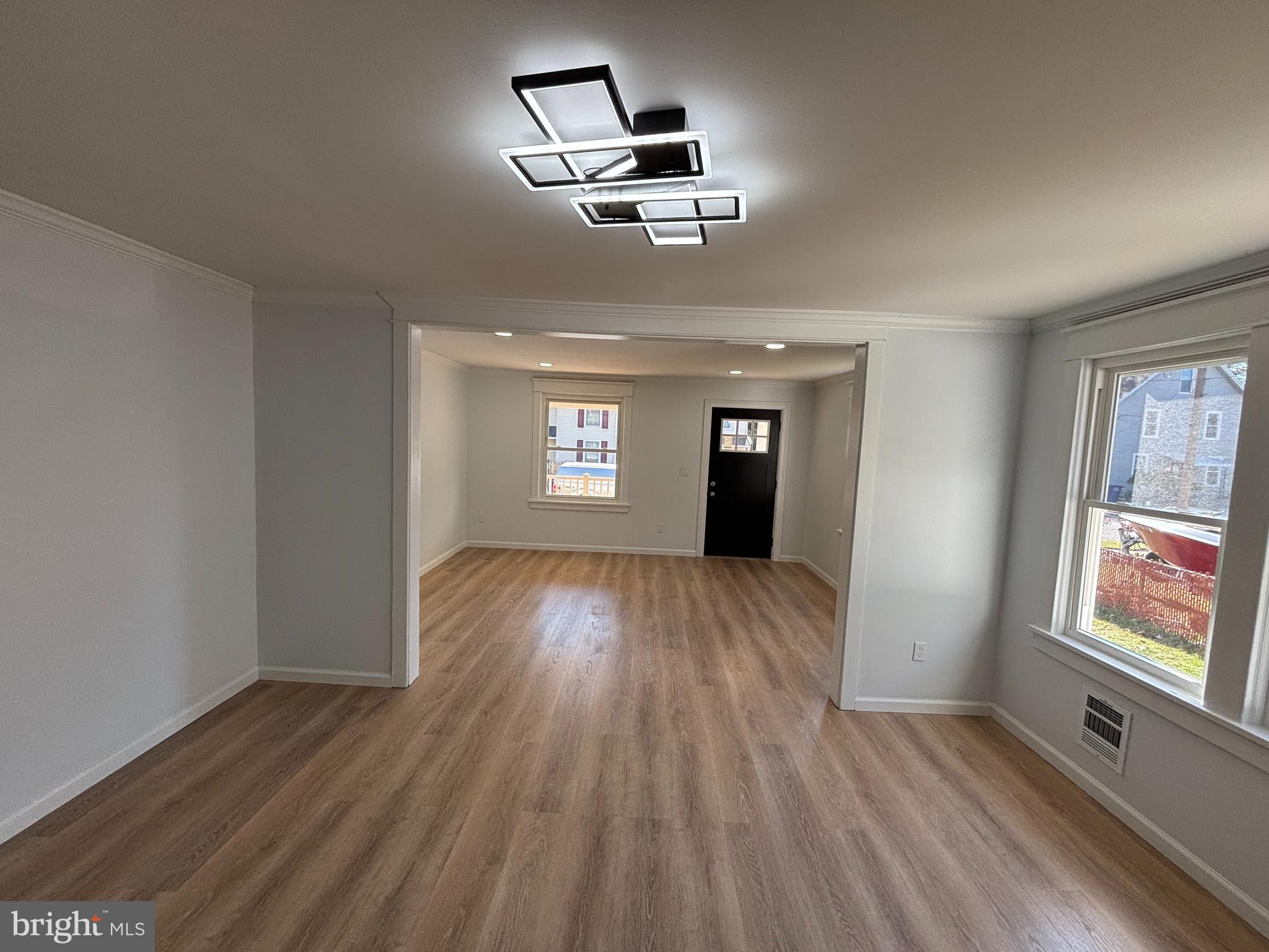 59 Pine Street Beverly, NJ 08010 - Photo 5 of 25 wooden floor in an empty room with a window