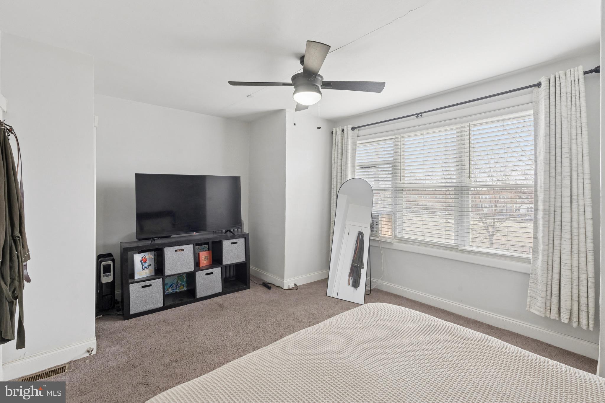 6532 Hegerman Street Philadelphia, PA 19135 - Photo 12 of 25 a view of a livingroom with furniture and a flat screen tv