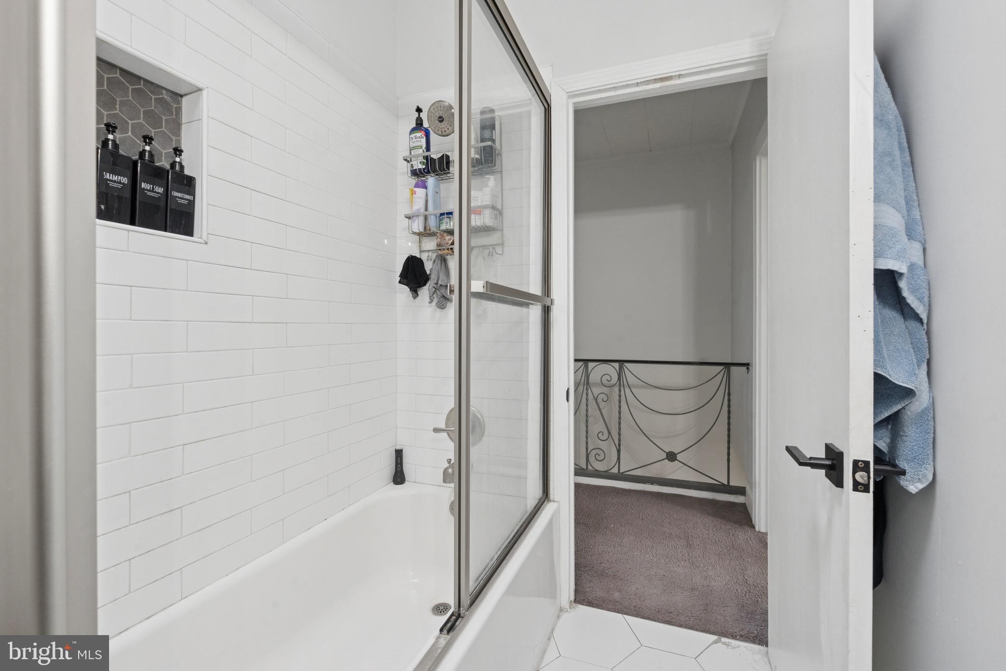 6532 Hegerman Street Philadelphia, PA 19135 - Photo 15 of 25 a bathroom with a bathtub and a shower
