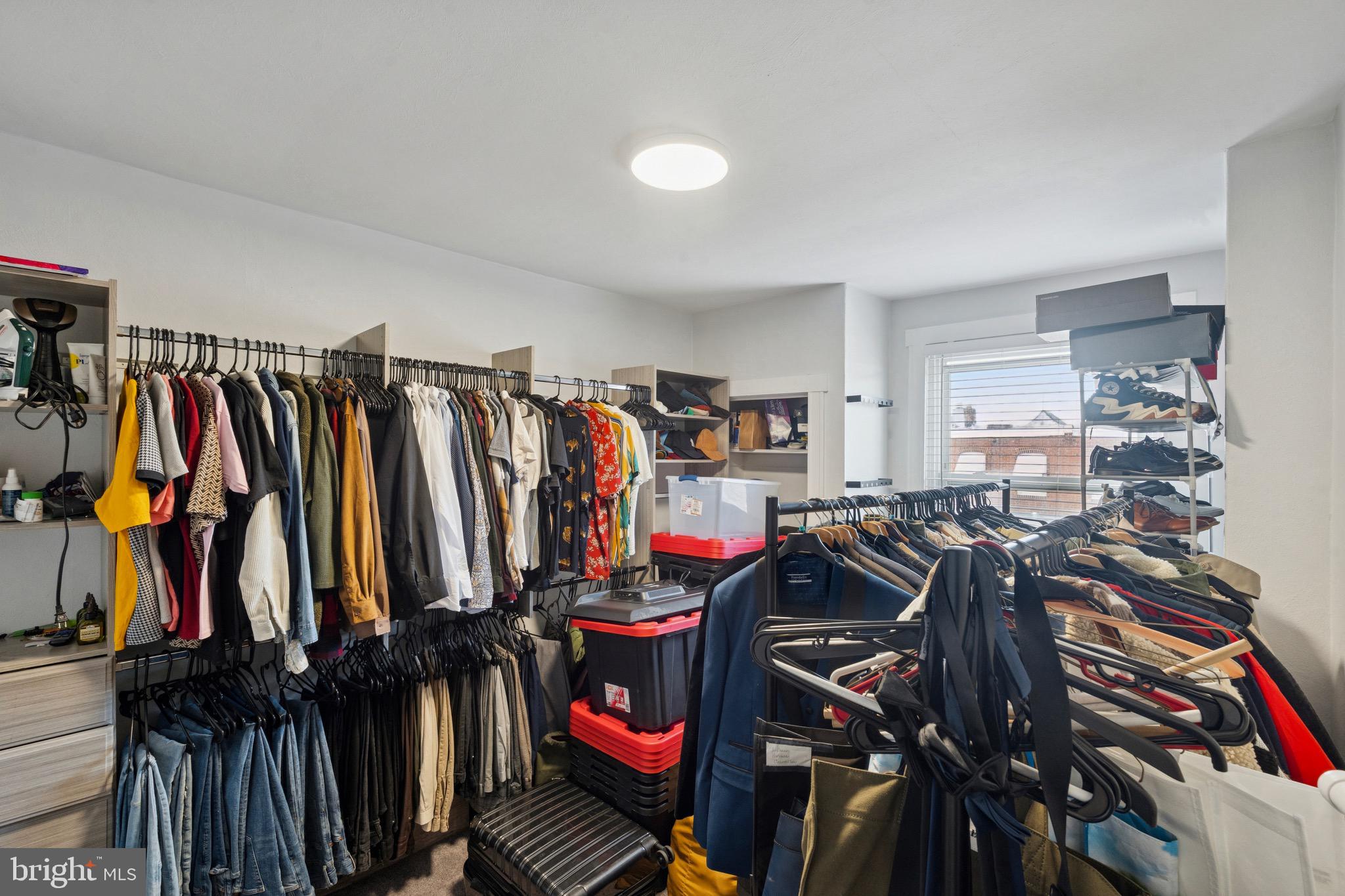 6532 Hegerman Street Philadelphia, PA 19135 - Photo 16 of 25 a view of walk in closet with clothes