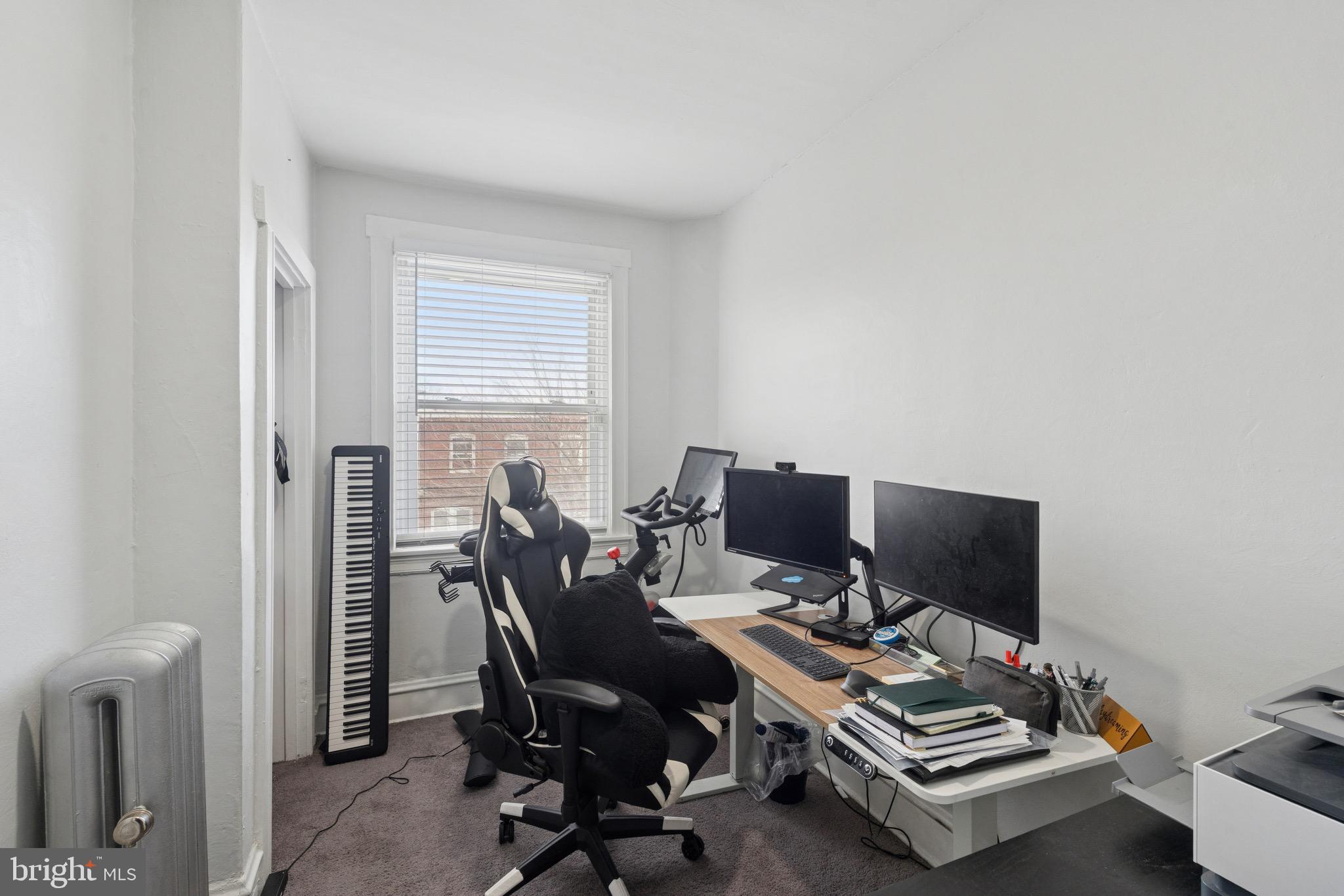 6532 Hegerman Street Philadelphia, PA 19135 - Photo 18 of 25 a view of a workspace with furniture and a window
