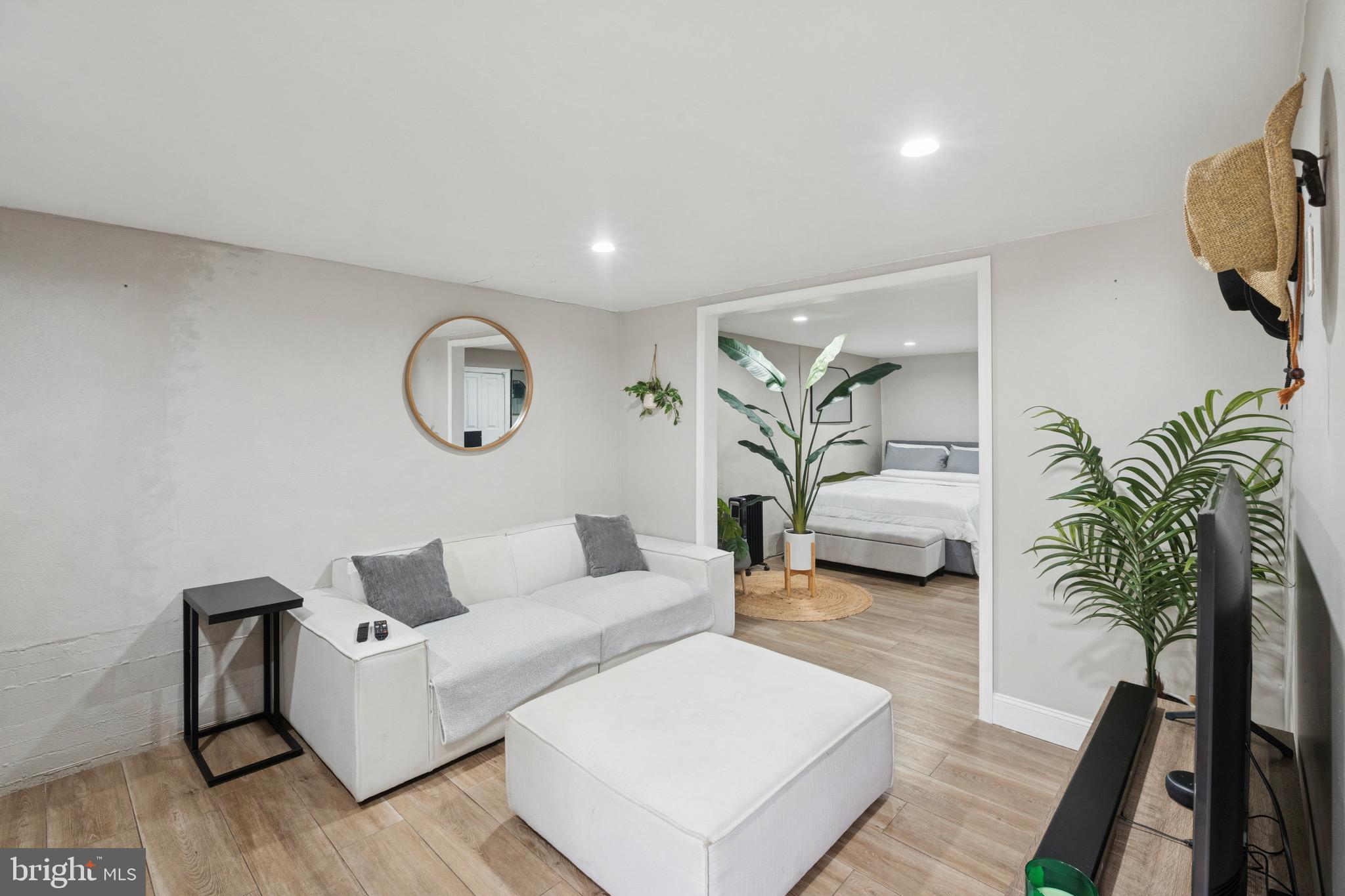 6532 Hegerman Street Philadelphia, PA 19135 - Photo 19 of 25 a living room with furniture and a potted plant