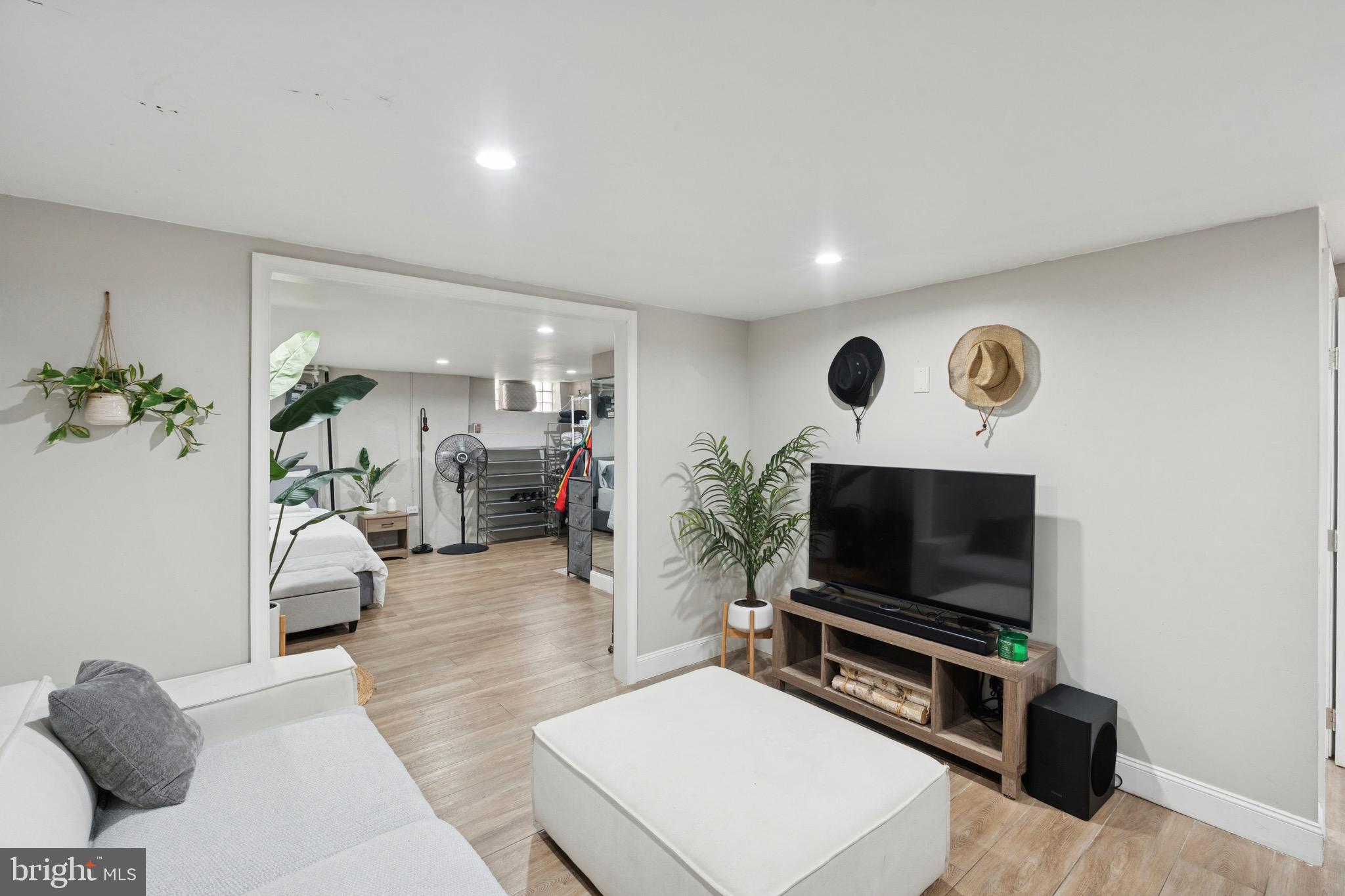 6532 Hegerman Street Philadelphia, PA 19135 - Photo 20 of 25 a living room with furniture and a flat screen tv