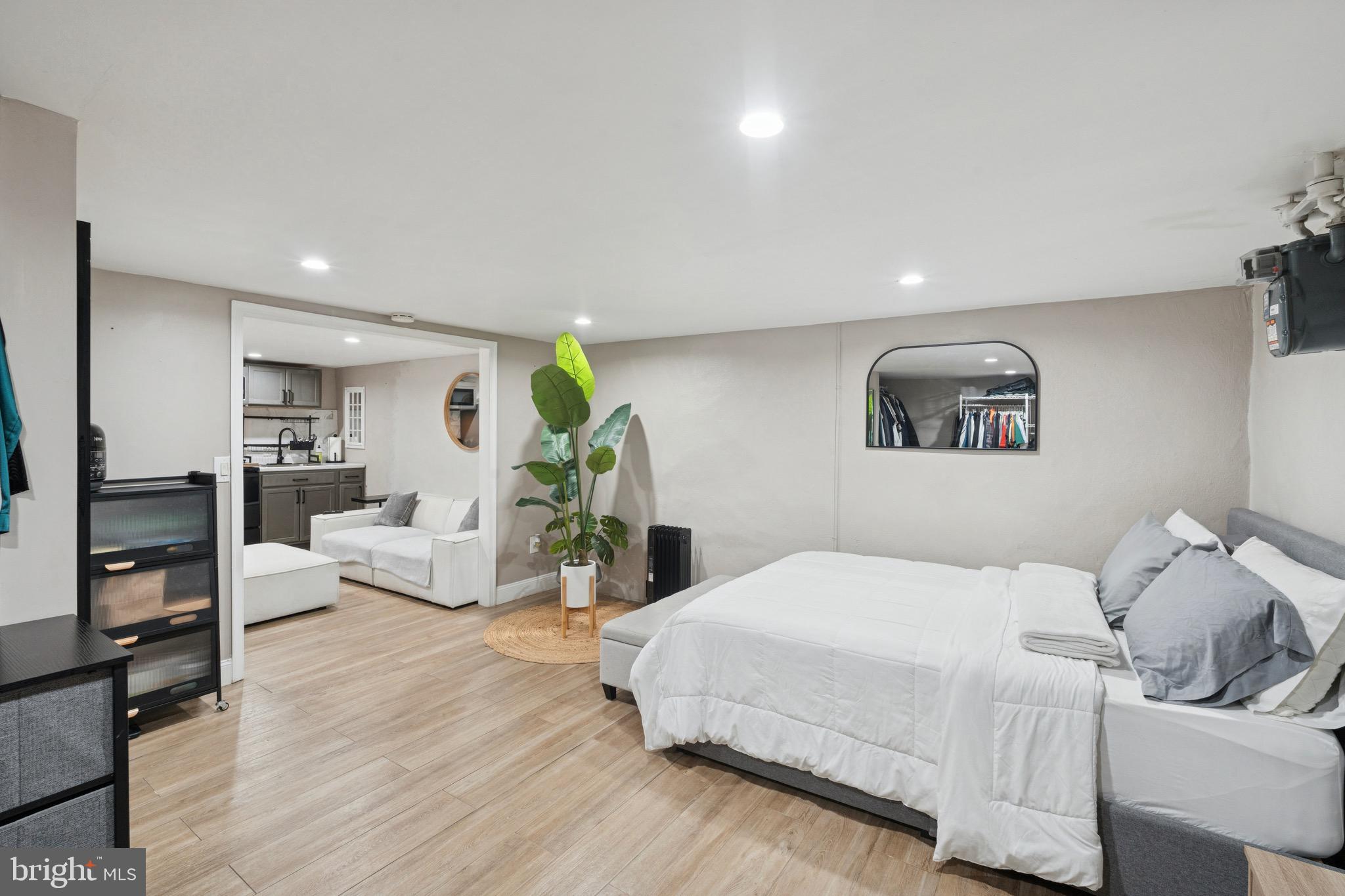 6532 Hegerman Street Philadelphia, PA 19135 - Photo 23 of 25 a bedroom with a bed and wooden floor
