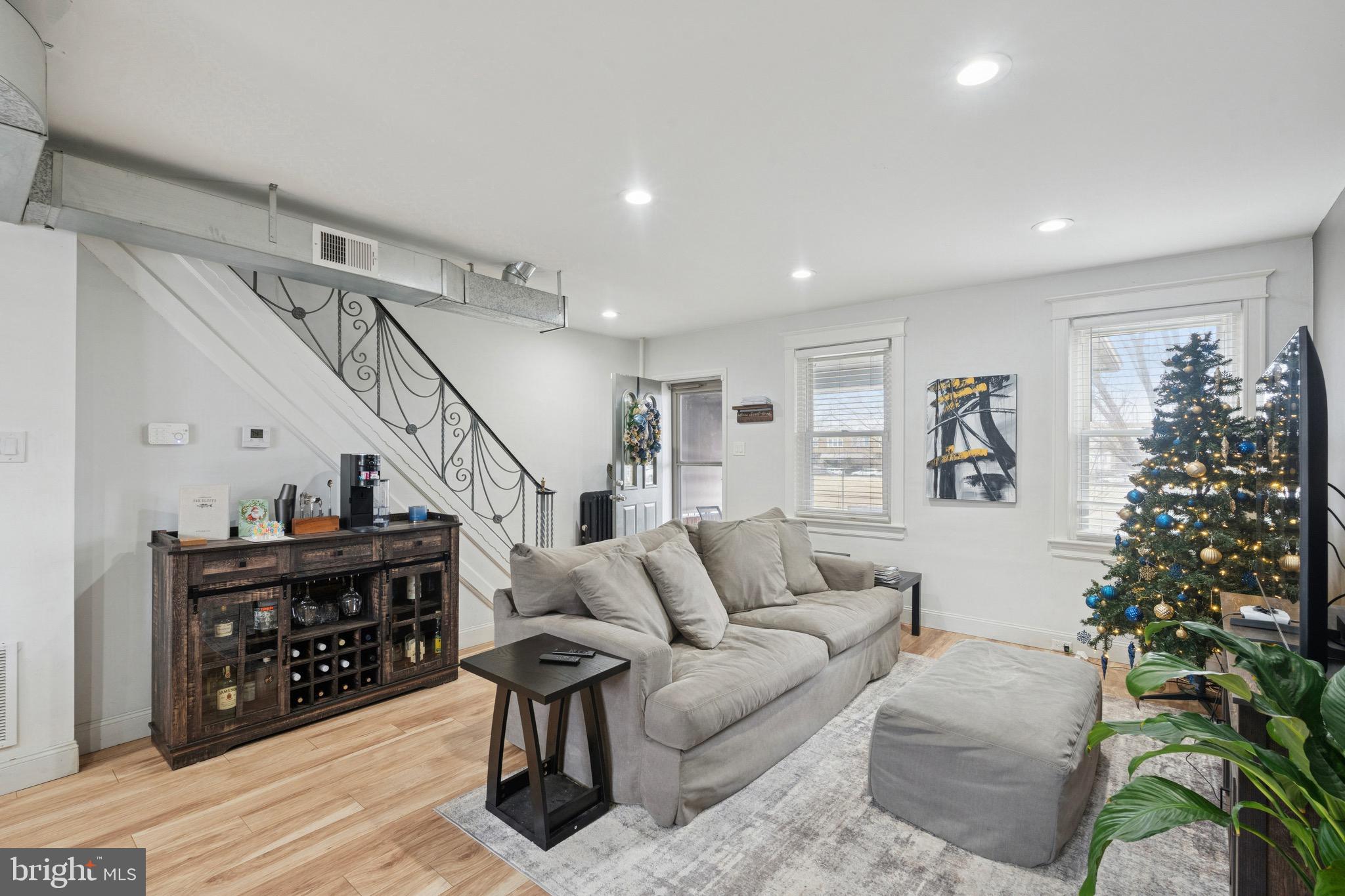 6532 Hegerman Street Philadelphia, PA 19135 - Photo 3 of 25 a living room with furniture and a potted plant