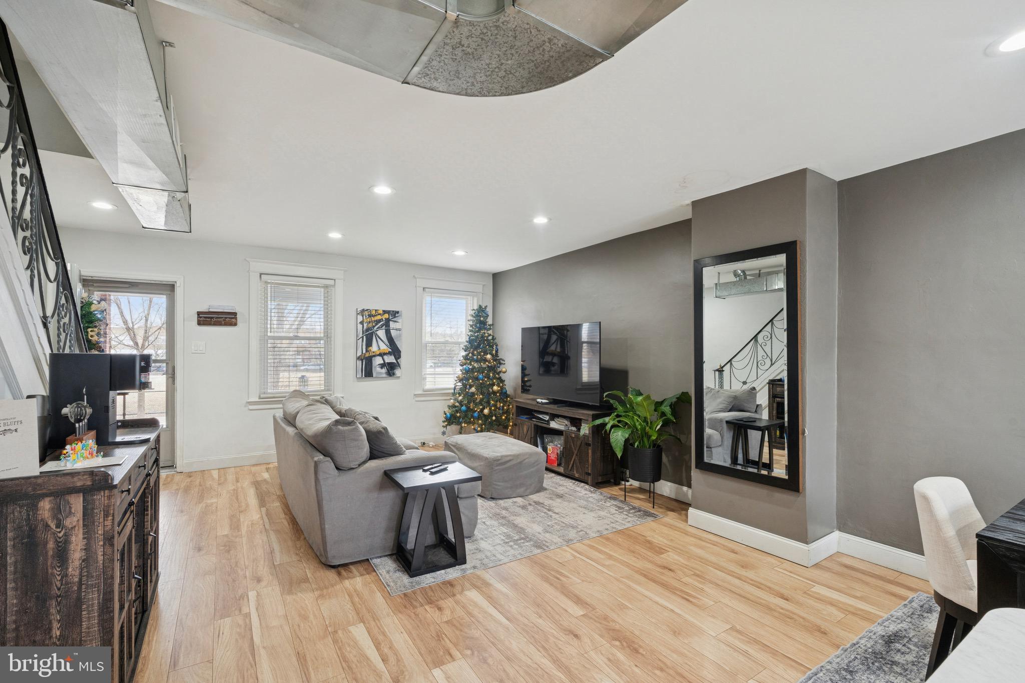 6532 Hegerman Street Philadelphia, PA 19135 - Photo 6 of 25 a living room with furniture and a flat screen tv