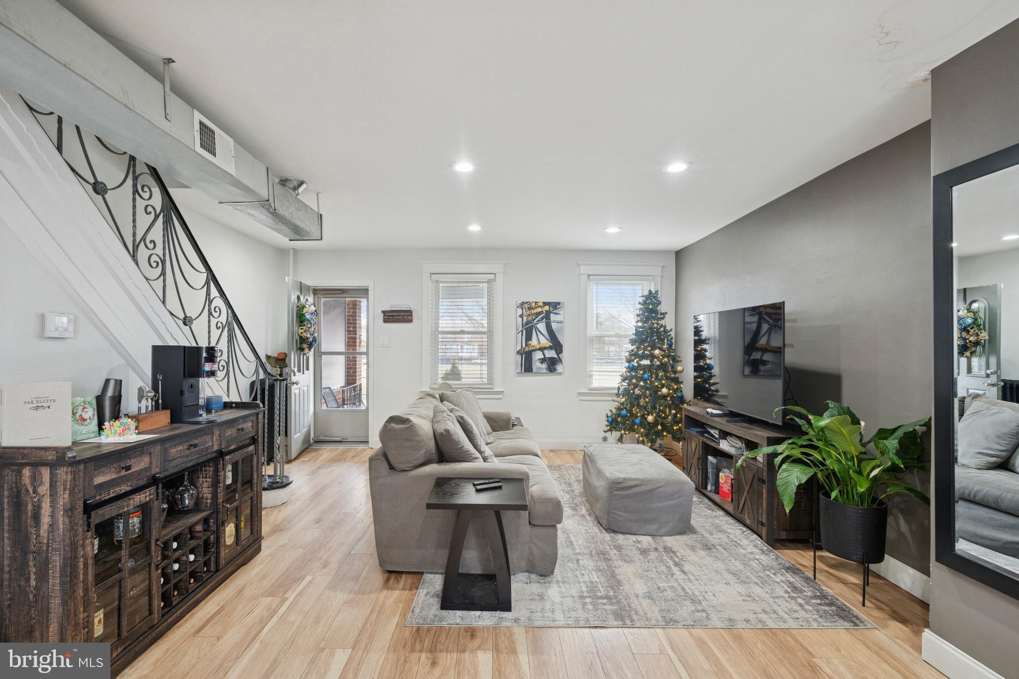 6532 Hegerman Street Philadelphia, PA 19135 - Photo 7 of 25 a living room with furniture and a flat screen tv