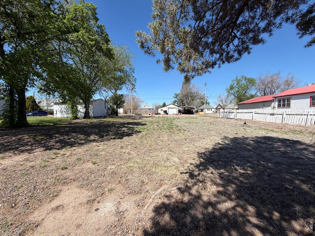 314 Colorado Avenue Stratton, CO 80836 - Photo 1 of 10 a view of dirt yard with a large tree