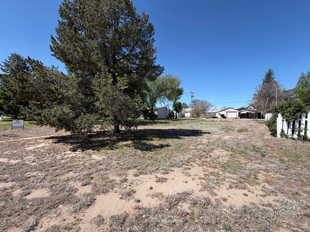 314 Colorado Avenue Stratton, CO 80836 - Photo 9 of 10 a view of dirt road with a building in the background
