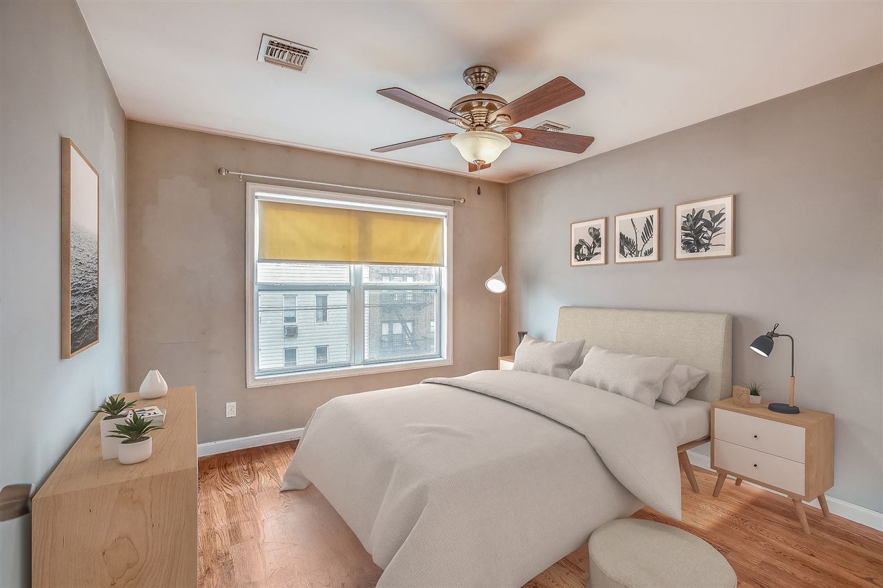 80 Madison Street, Unit 4 Hoboken, NJ 07030 - Photo 11 of 19 a bedroom with a bed and a window