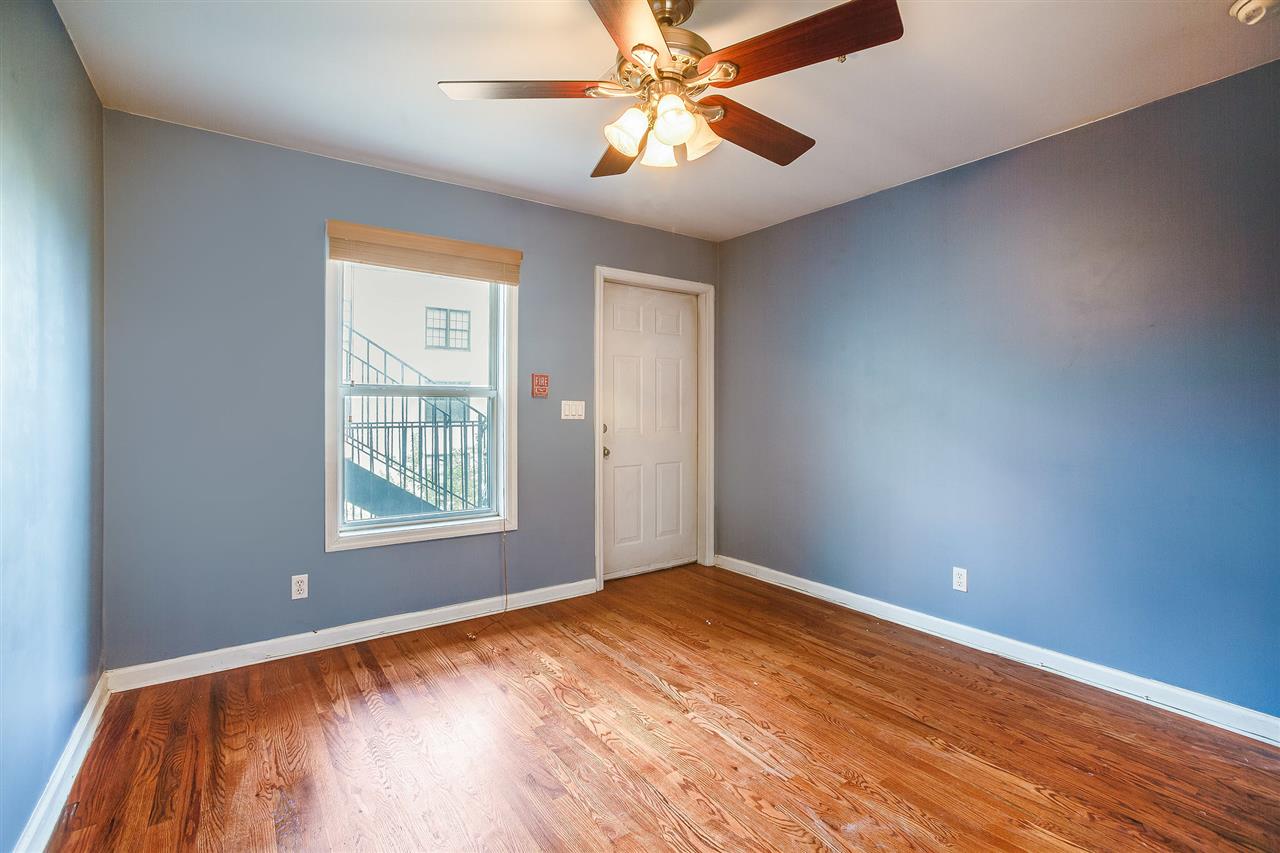 80 Madison Street, Unit 4 Hoboken, NJ 07030 - Photo 13 of 19 wooden floor in an empty room with a window