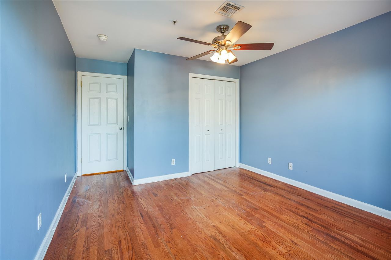 80 Madison Street, Unit 4 Hoboken, NJ 07030 - Photo 14 of 19 wooden floor in an empty room with a window