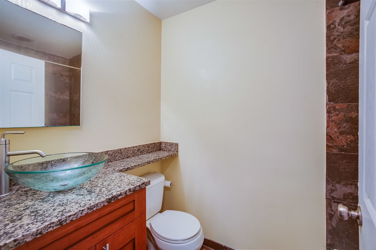 80 Madison Street, Unit 4 Hoboken, NJ 07030 - Photo 15 of 19 a bathroom with a granite countertop toilet and sink