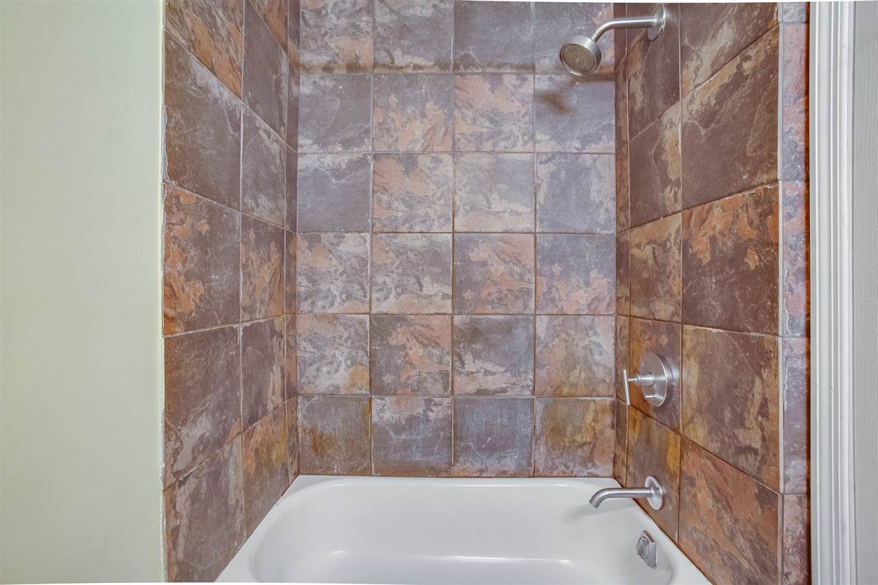 80 Madison Street, Unit 4 Hoboken, NJ 07030 - Photo 16 of 19 a bathroom with a bathtub