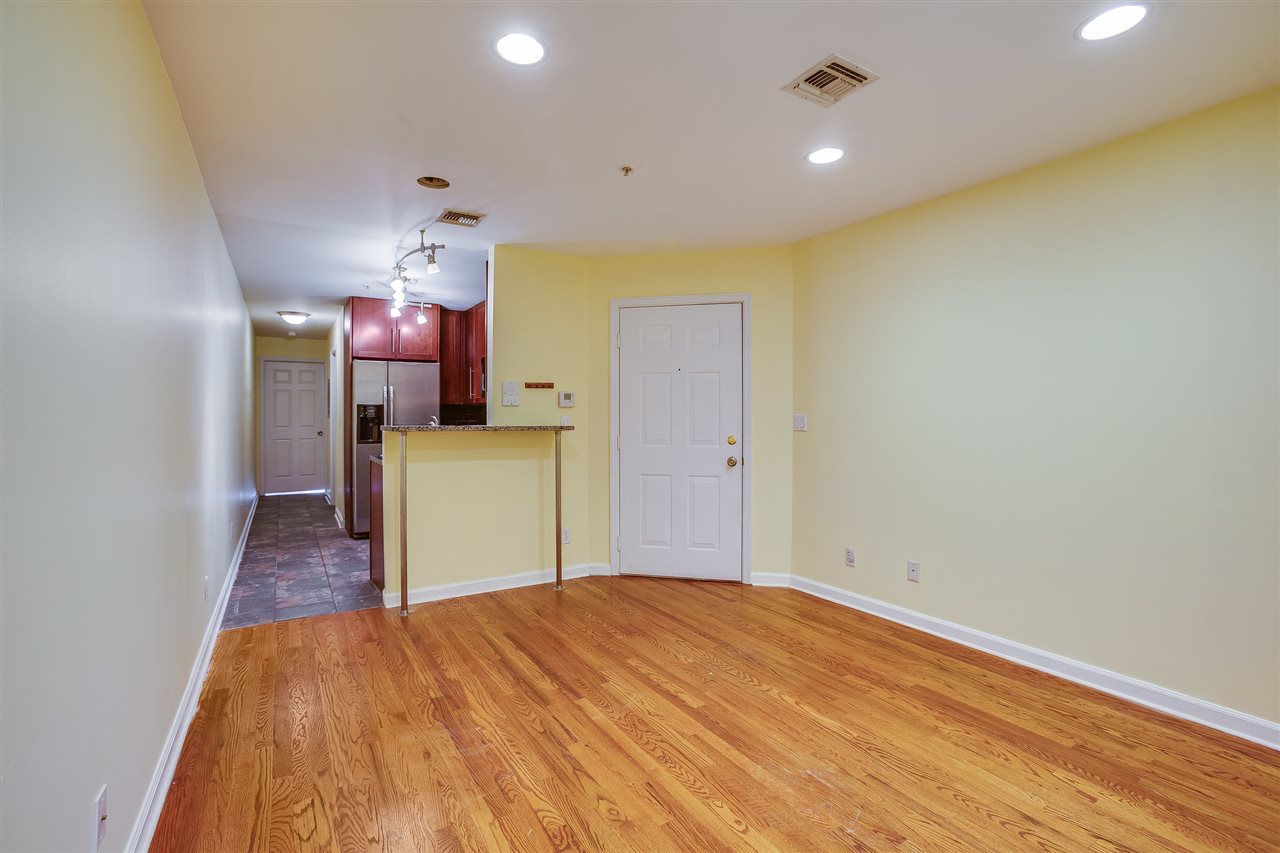 80 Madison Street, Unit 4 Hoboken, NJ 07030 - Photo 3 of 19 a bedroom with a bed and wooden floor