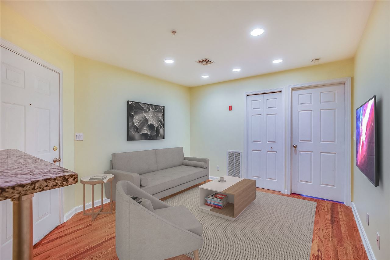 80 Madison Street, Unit 4 Hoboken, NJ 07030 - Photo 4 of 19 a living room with furniture and a wooden floor