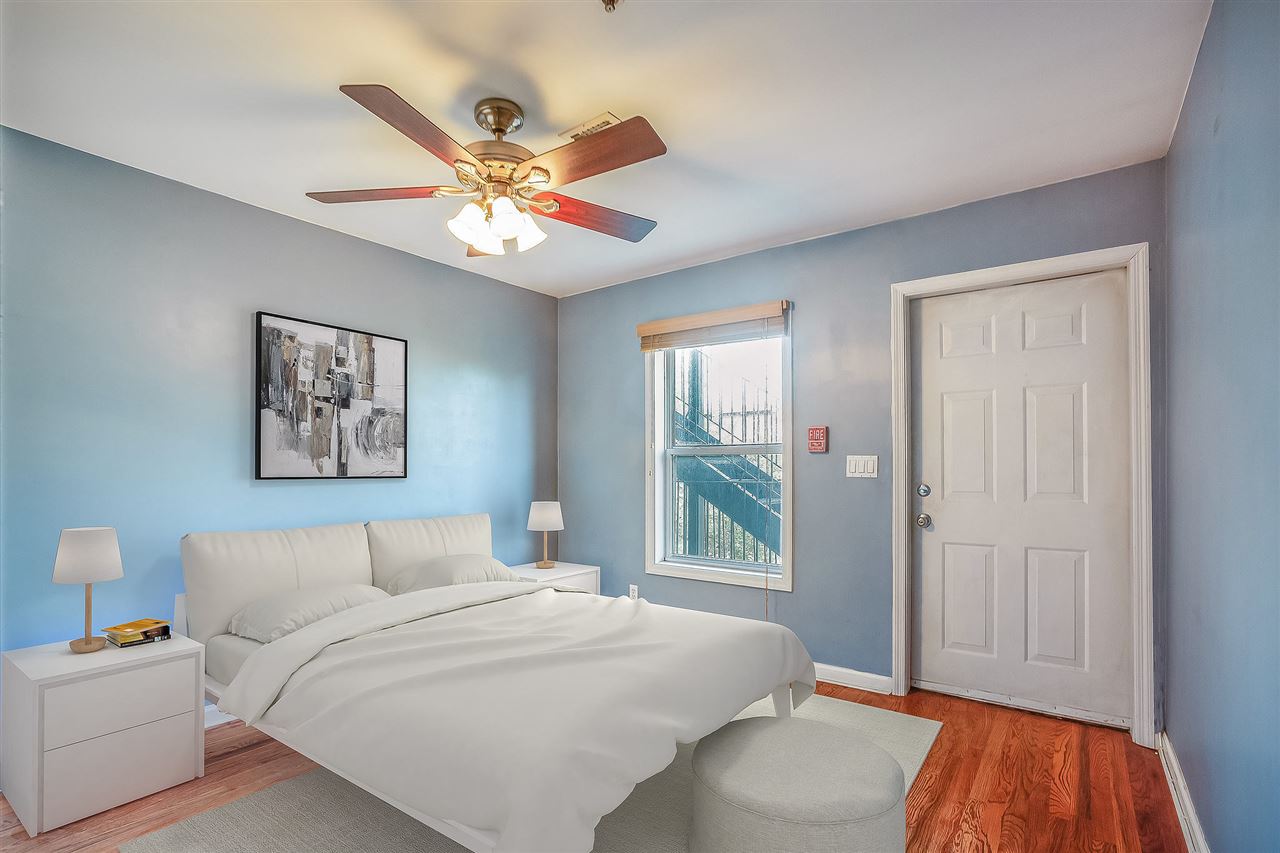 80 Madison Street, Unit 4 Hoboken, NJ 07030 - Photo 10 of 19 a bedroom with a bed and a window