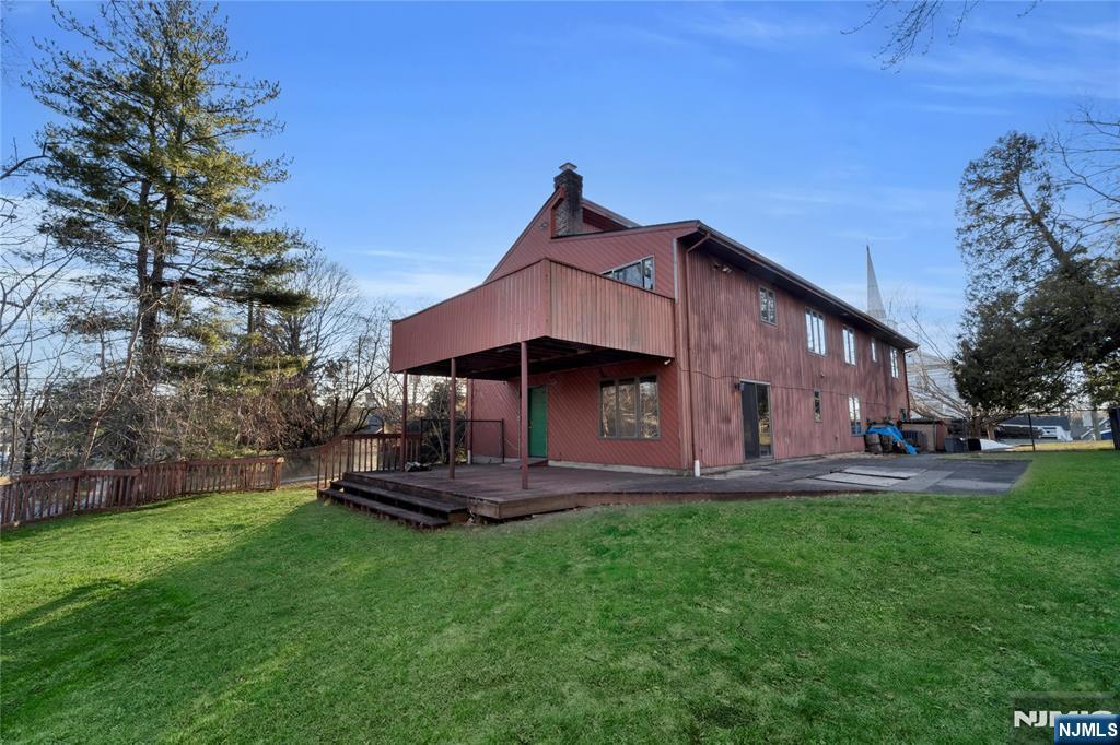 325 High Street Closter, NJ 07624 - Photo 27 of 34 a front view of a house with a yard