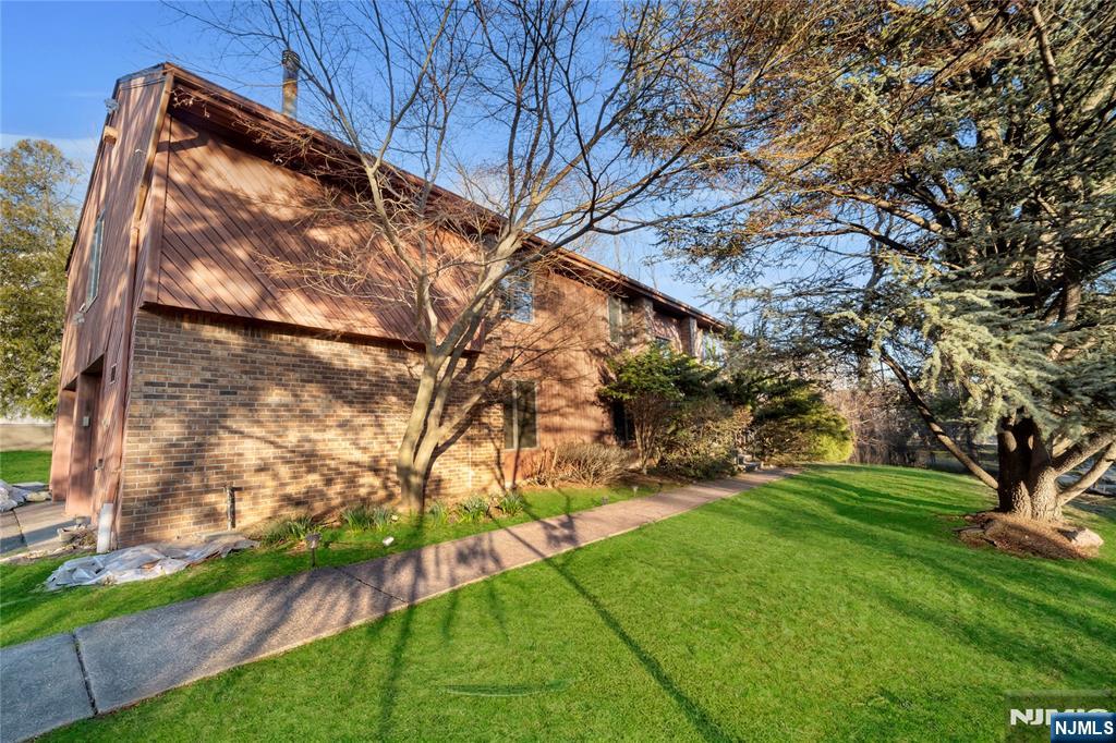 325 High Street Closter, NJ 07624 - Photo 29 of 34 a view of backyard with tree