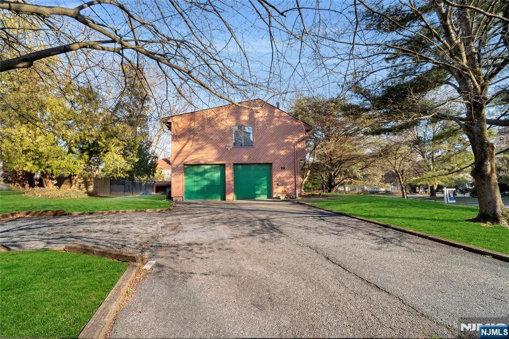 325 High Street Closter, NJ 07624 - Photo 30 of 34 a backyard of a house with lots of green space