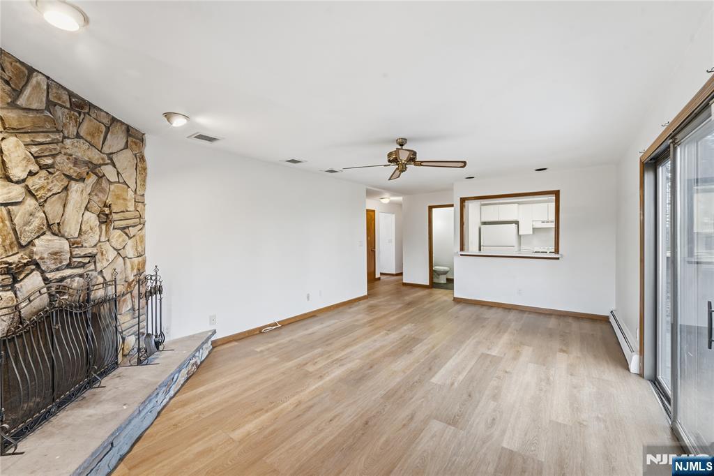 325 High Street Closter, NJ 07624 - Photo 3 of 34 wooden floor in an empty room with a window