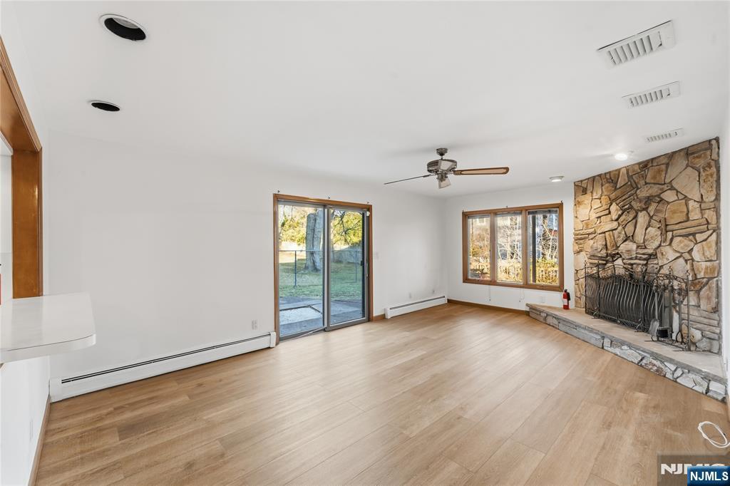 325 High Street Closter, NJ 07624 - Photo 4 of 34 a view of an empty room with a window and wooden floor